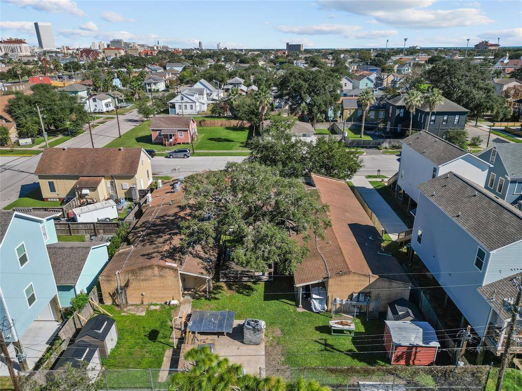 This aerial photo gives a broad view of the property. The presence of trees and green spaces indicates how great this property would be for someone who values nature and outdoor living, while being within close proximity to urban activities.