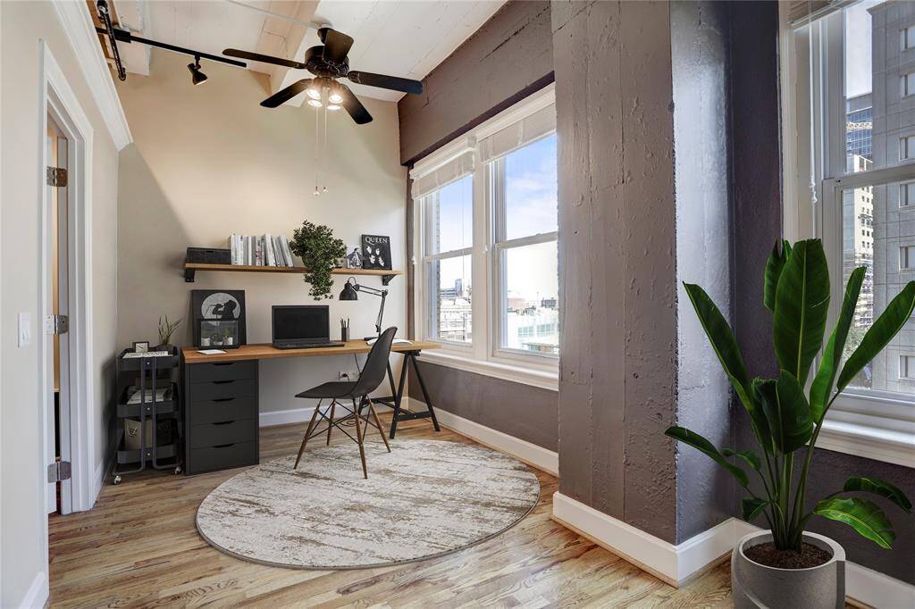A closer look at the potential office area, bathed in natural light and leading into the second bedroom to the left. You’ll also enjoy a beautiful view of Downtown with Diakin parks a few blocks away.  This photo is virtually staged.