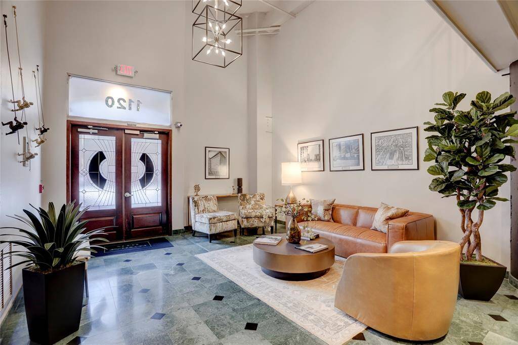 Here’s a closer look at the lobby, where you’ll notice its elegant design and inviting atmosphere. For added convenience and security, access to the building is granted via a fob or app, making entry smooth and simple.