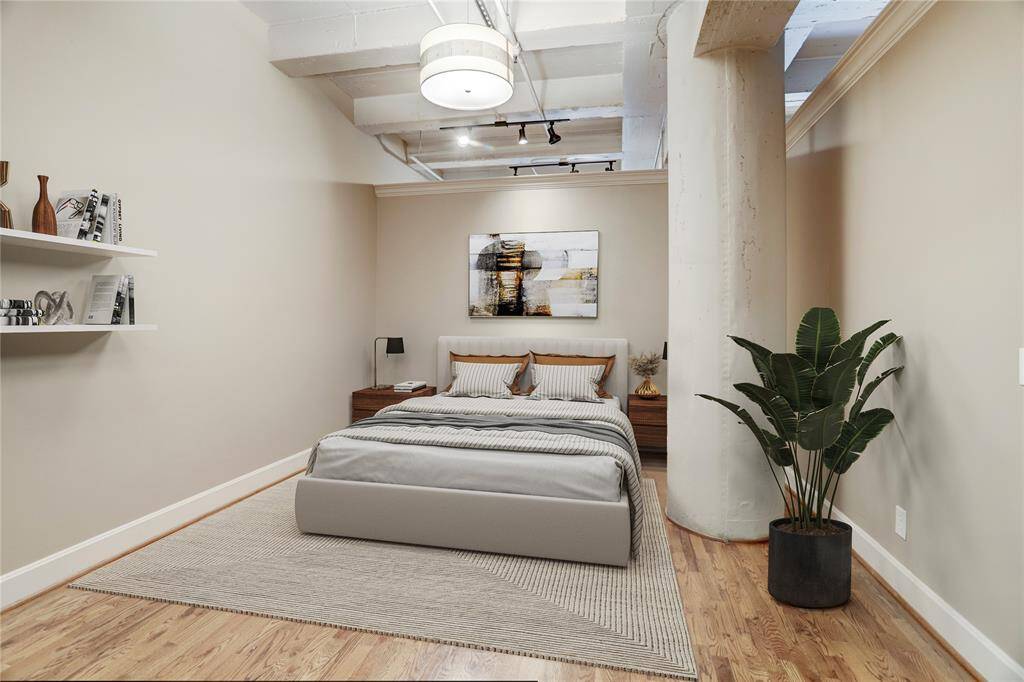 The primary bedroom offers a spacious and relaxing atmosphere, with plenty of natural light streaming in. It’s a serene space that provides all the room you need to create your perfect retreat. This photo is virtually staged.