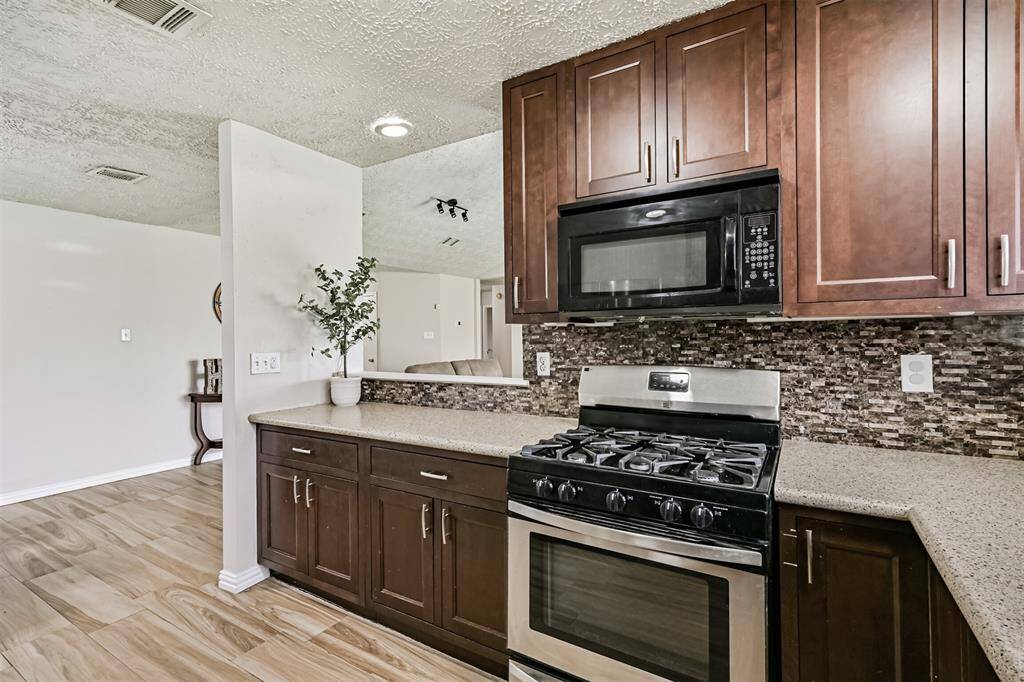 View of the kitchen looking into the living room