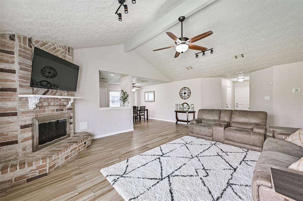 View of the living room looking into the dining room and entry way