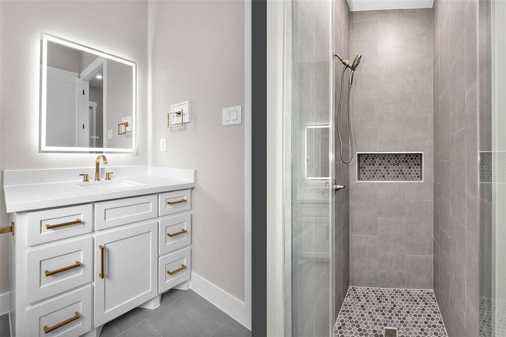 A guest bathroom with modern fixtures, featuring a sleek vanity, stylish tilework, and a glass-enclosed shower/tub combo.