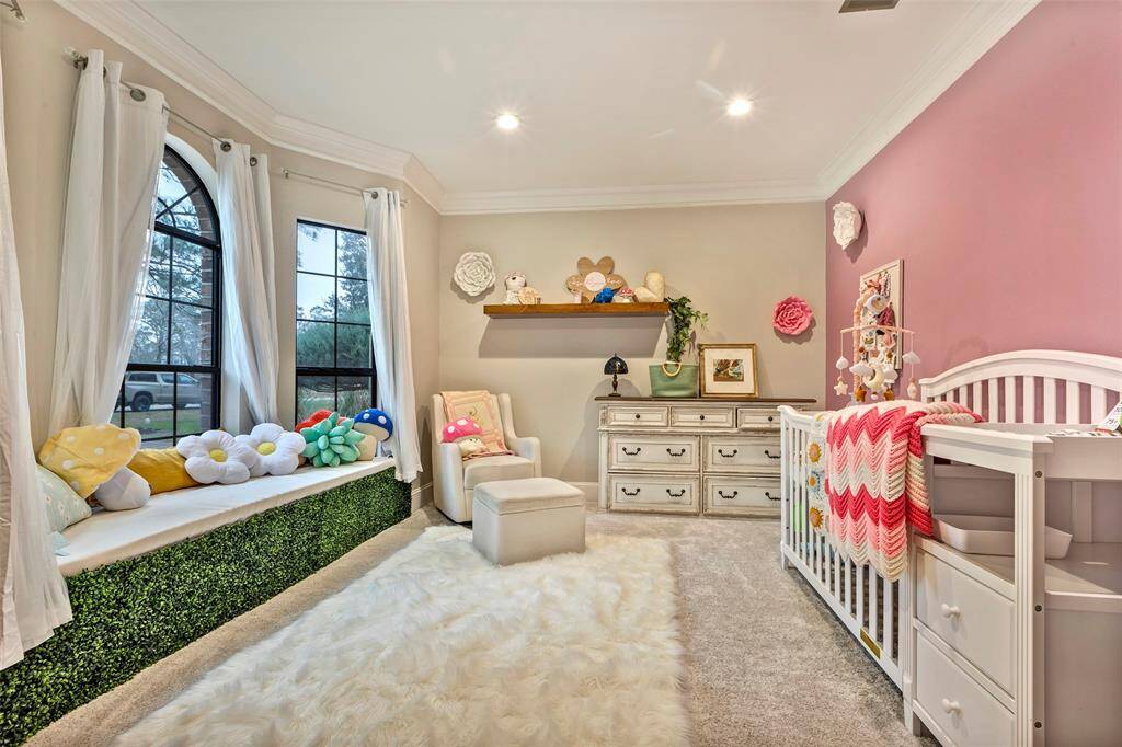 While this room was originally designed as a study, it is being used as a fourth bedroom and is filled with natural light.
