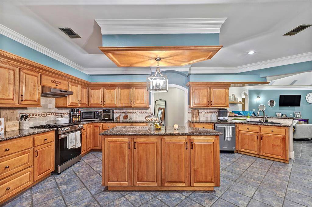 From every angle, there is storage for all of your kitchen appliances and cookware.