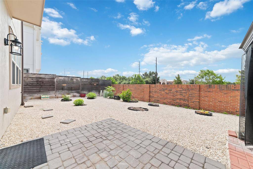 Large Backyard covered with Gravel Stone