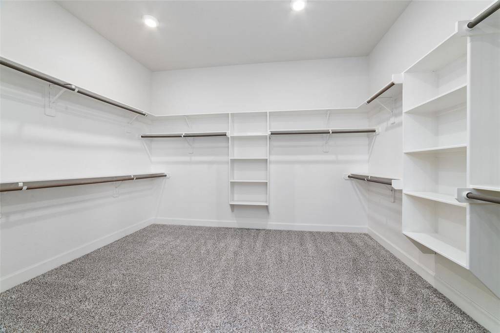 Walk in closet in primary bedroom