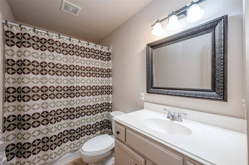 Hall bath located at the end of entry hall.