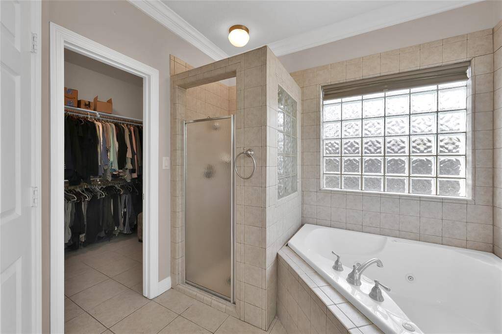 One of the secondary bedrooms with a double door walk in closet. The seller is preparing to move so this can become your home!