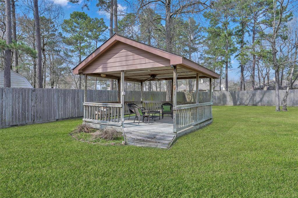A shed behind the garage out of view from most of the home gives you space to store your lawn equipment and other outside items.
