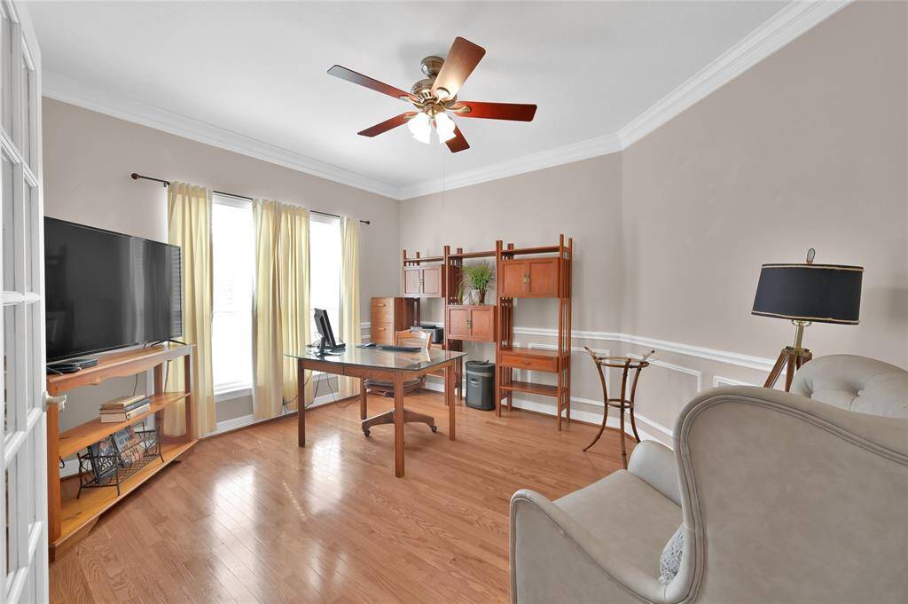 Just off the foyer to the left is the private study complete with hard wood floors, crown and decorative moldings, ceiling fan and glass French doors. To top it off, you have a beautiful large window to look to the front yard while you work.
