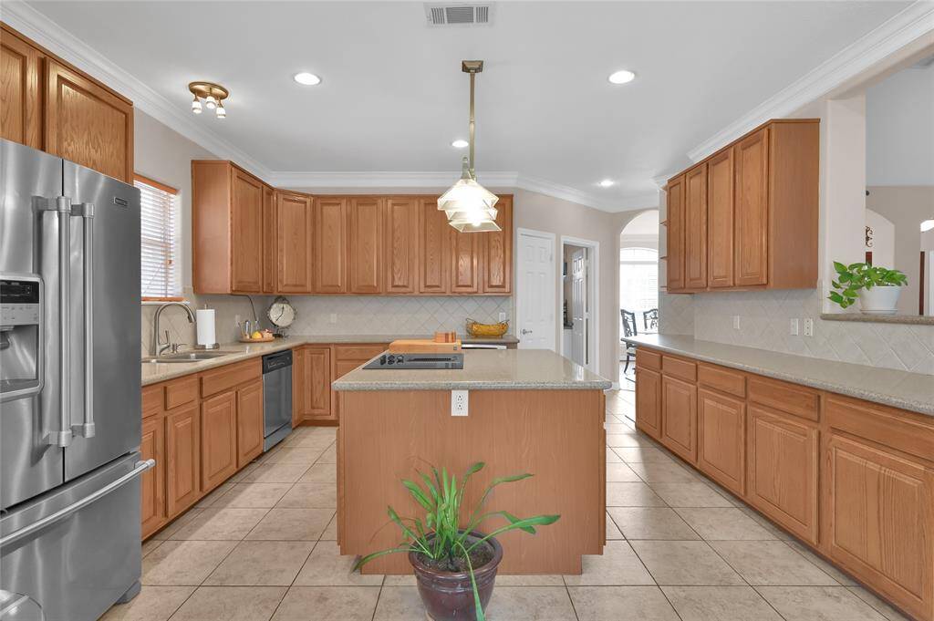 The Kitchen is a spacious area with a large center island with storage on both sides, electrical plugs on each end and overhead lighting. An abundance of cabinets allow you to store all your cooking essentials and much more. The huge walk-in pantry located just beyond the room with space for all your food items.
