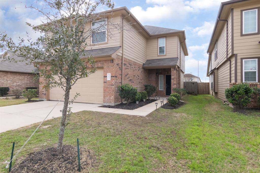 The house is located on a well-maintained street with neighboring homes close by.