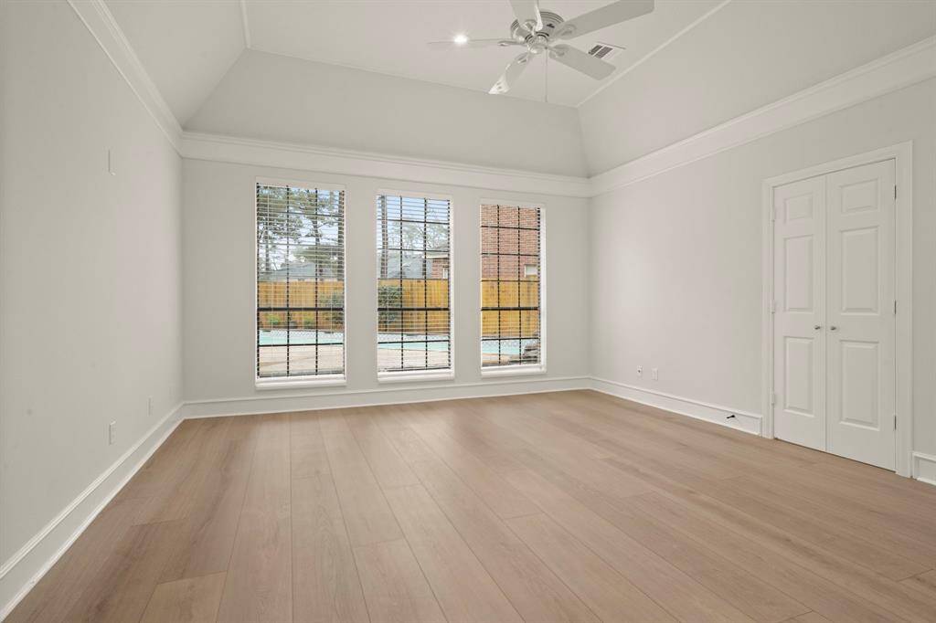 Step into a tranquil retreat, where triple windows bathe the primary bedroom in natural light.