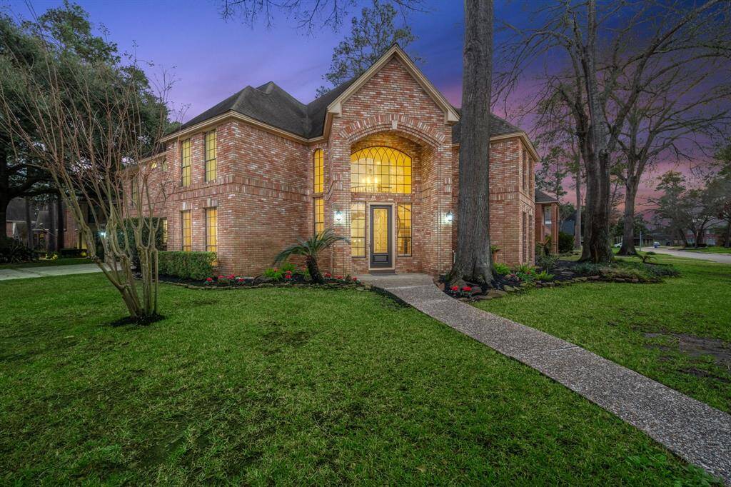 Tucked away on a no-outlet street, this serene escape offers privacy, mature trees, and Bluetooth-controlled sprinklers for effortless lawn maintenance.