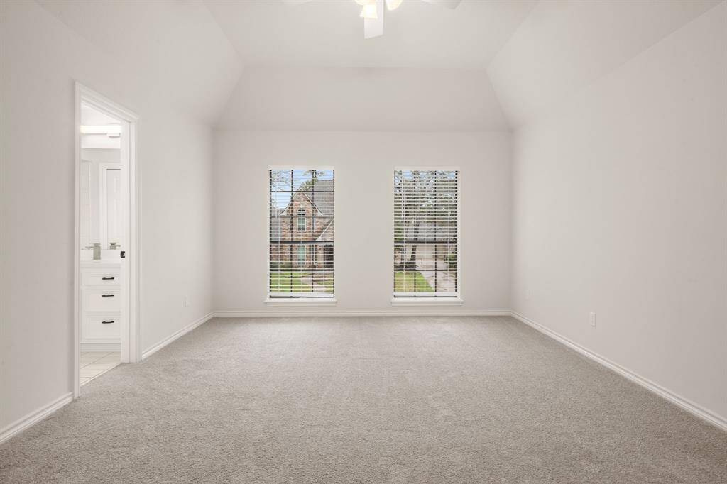 Guests will feel right at home in this private and inviting space.Designed for comfort, the upstairs guest suite features plush carpet, a ceiling fan, and ample natural light.