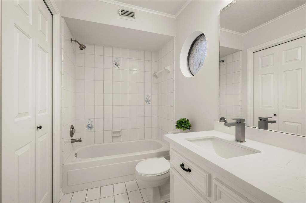 A private ensuite bath with a single quartz vanity and a spacious walk-in closet ensures convenience.