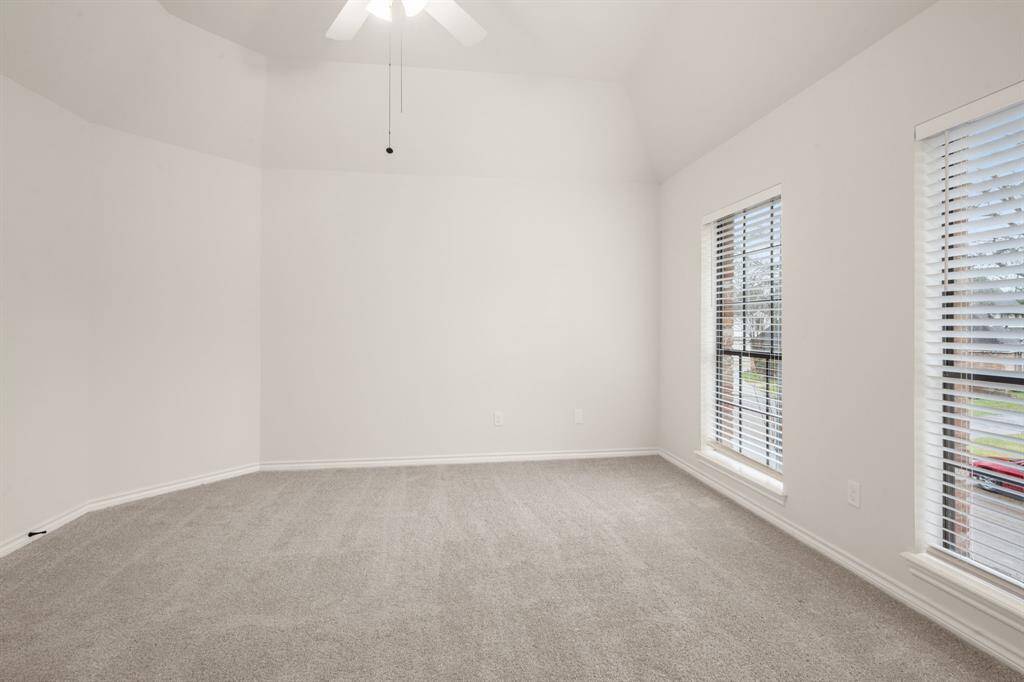 Each secondary bedroom is designed with comfort in mind, featuring soft carpet, ceiling fans, and ample closet space.