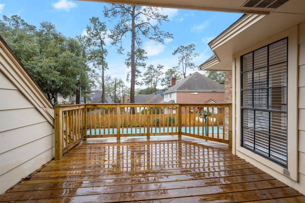 One bedroom includes a private exit to the newly rebuilt balcony, offering a stunning backyard view.