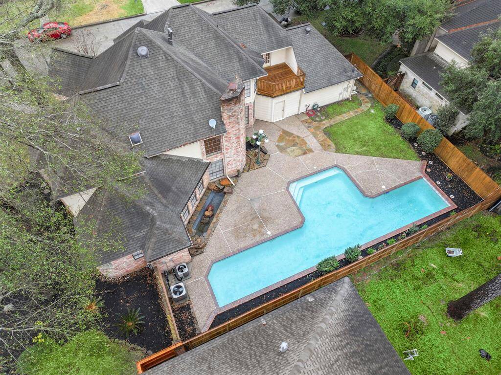 Tucked away on a no-outlet street, this serene escape offers privacy, mature trees, and Bluetooth-controlled sprinklers for effortless lawn maintenance.