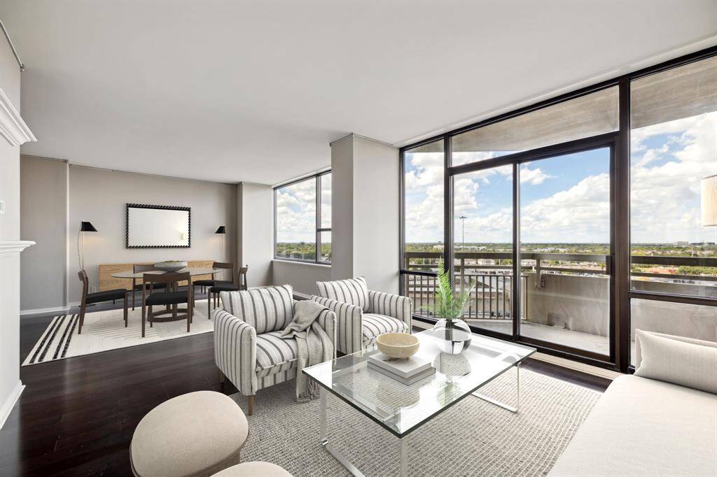 Engineered hardwood floors and a private balcony. Image shown virtually staged.