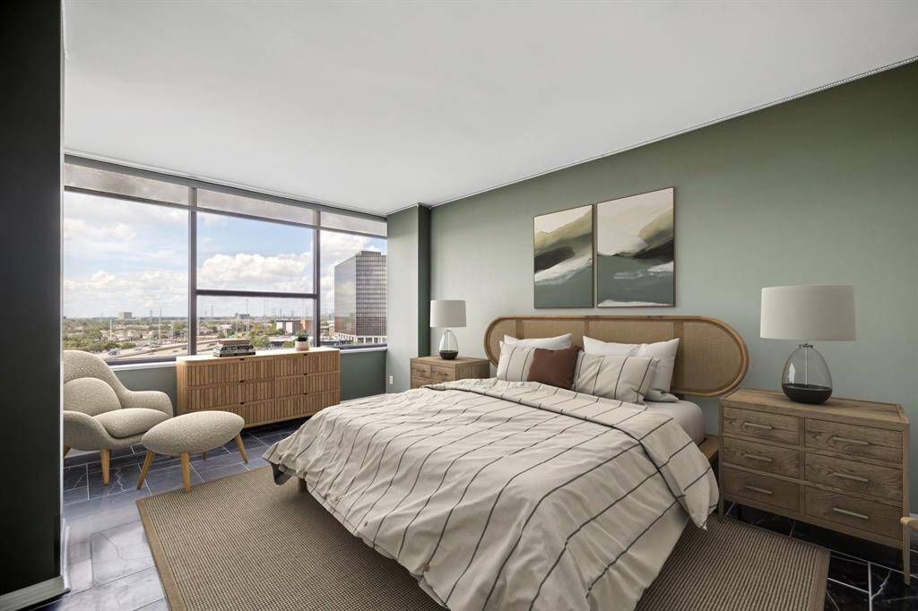 Spacious 18 x 12 primary suite with tiled floors. Image shown virtually staged.