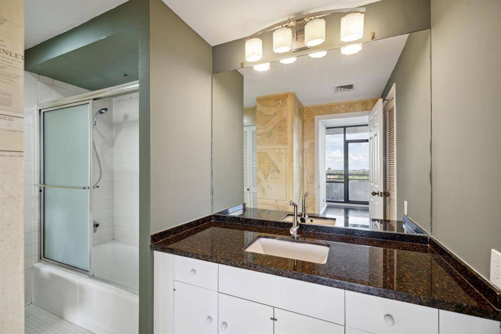 Bathroom with granite counters with pass through access from the living areas and the bedroom.
