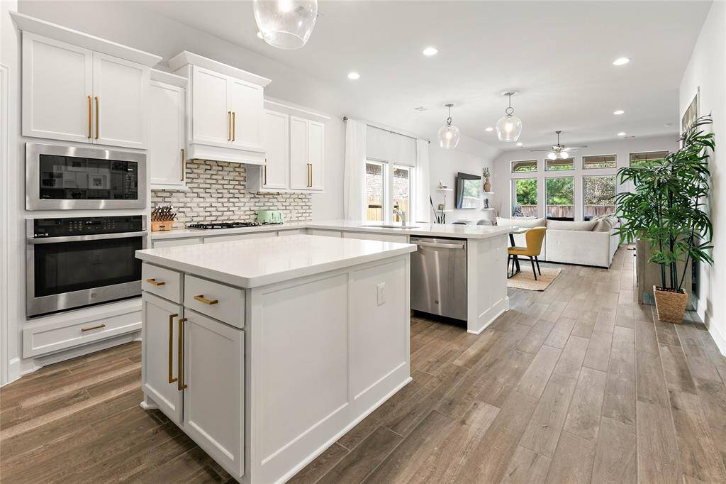 Beautiful wood look tile flooring flows thru all living spaces and bedrooms.