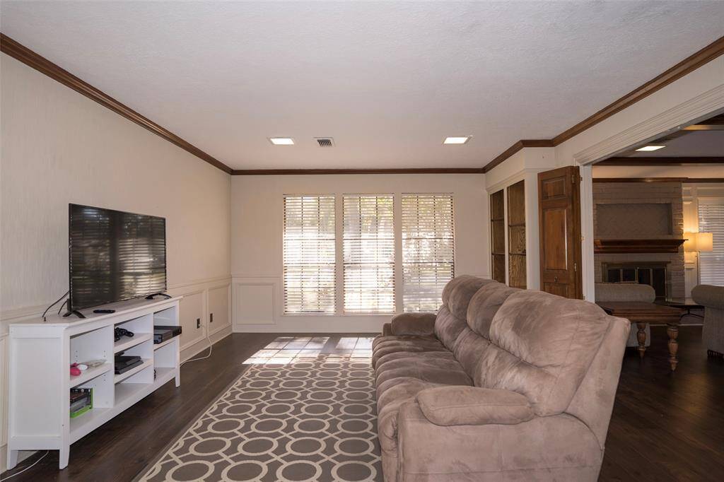 Welcome to the versatile den/game room—perfect for a game setup or easily transformed into a home office to suit your needs.