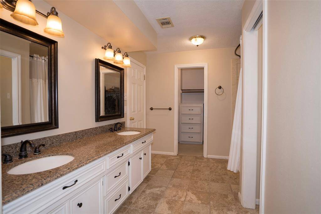 It features elegant granite countertops.