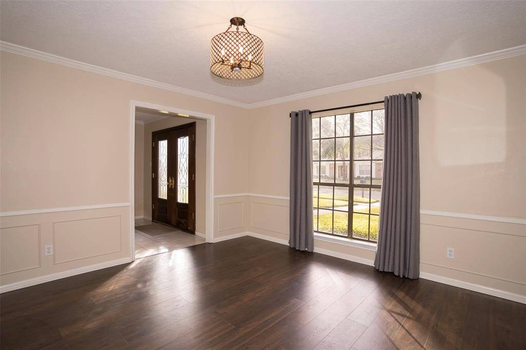 As you walk in, you are greeted by the elegant formal dining room.