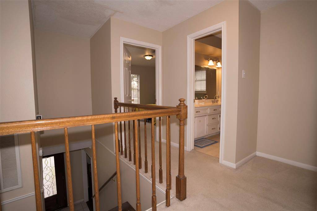 A view from the hallway offering a glimpse of the bedroom and bathroom, showcasing the easy flow to the private spaces.