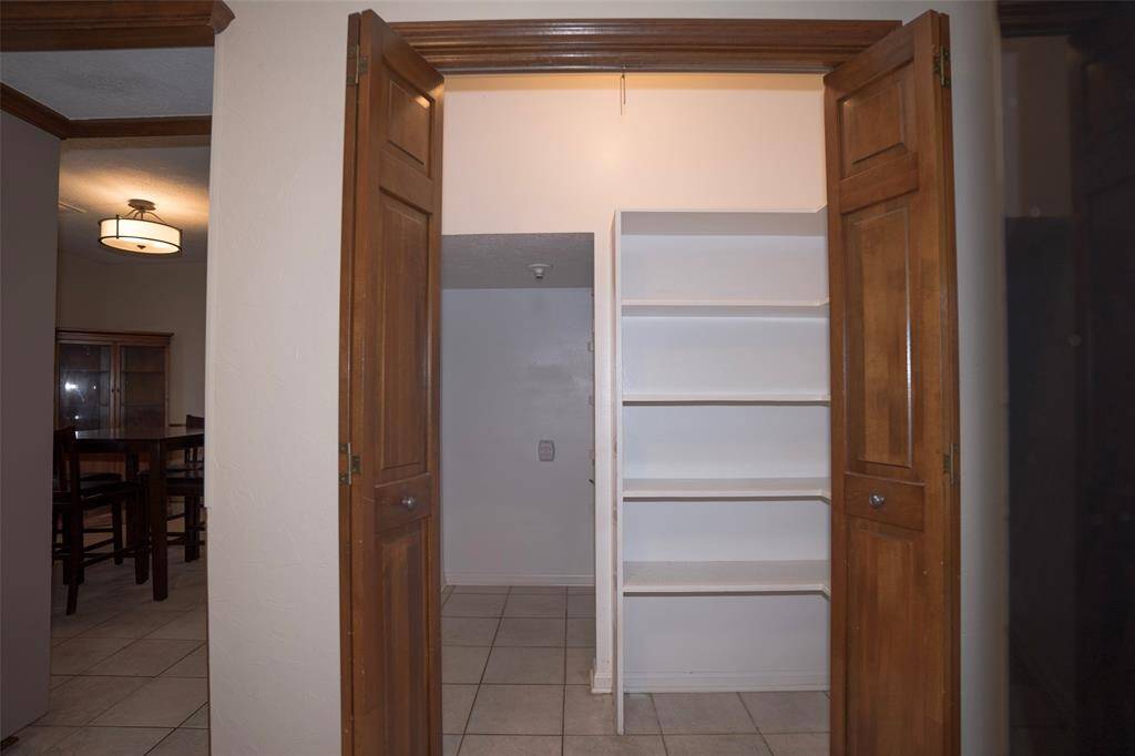 Another view of the pantry showcasing its spacious interior, offering plenty of room for all your storage needs.