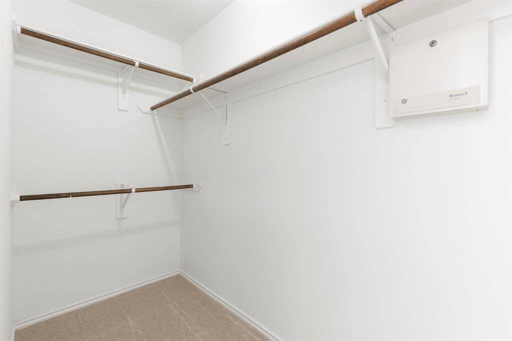 Spacious primary walk-in  closet.