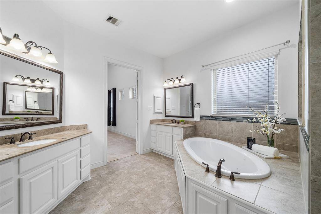 The Spa like Primary bath is perfect for relaxation and functionality.