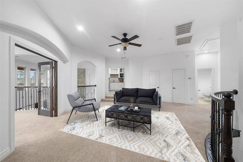The double game room areas upstairs has multiple use options.  it can be an additional game room or cozy upstairs living/ gathering area.  Digitally staged.