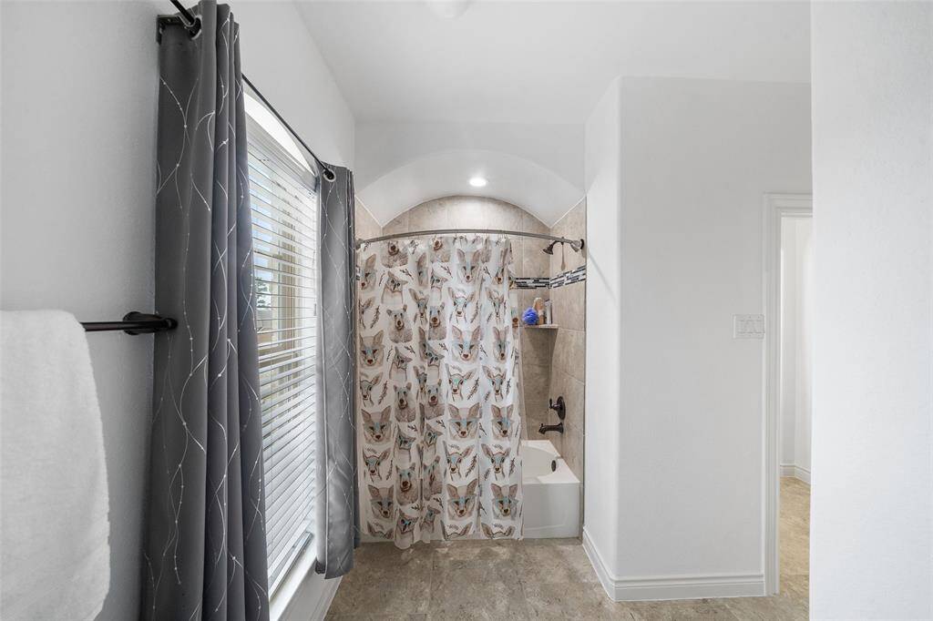 The large upstairs bathroom has plenty of room to move around.