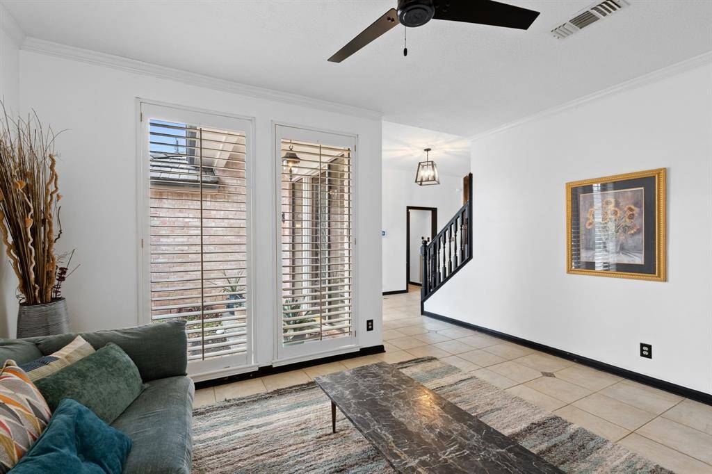 Another angle shows the plantation shutters overlooking the front porch.