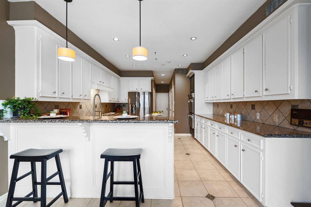 Ample room to gather for meals including the breakfast bar.