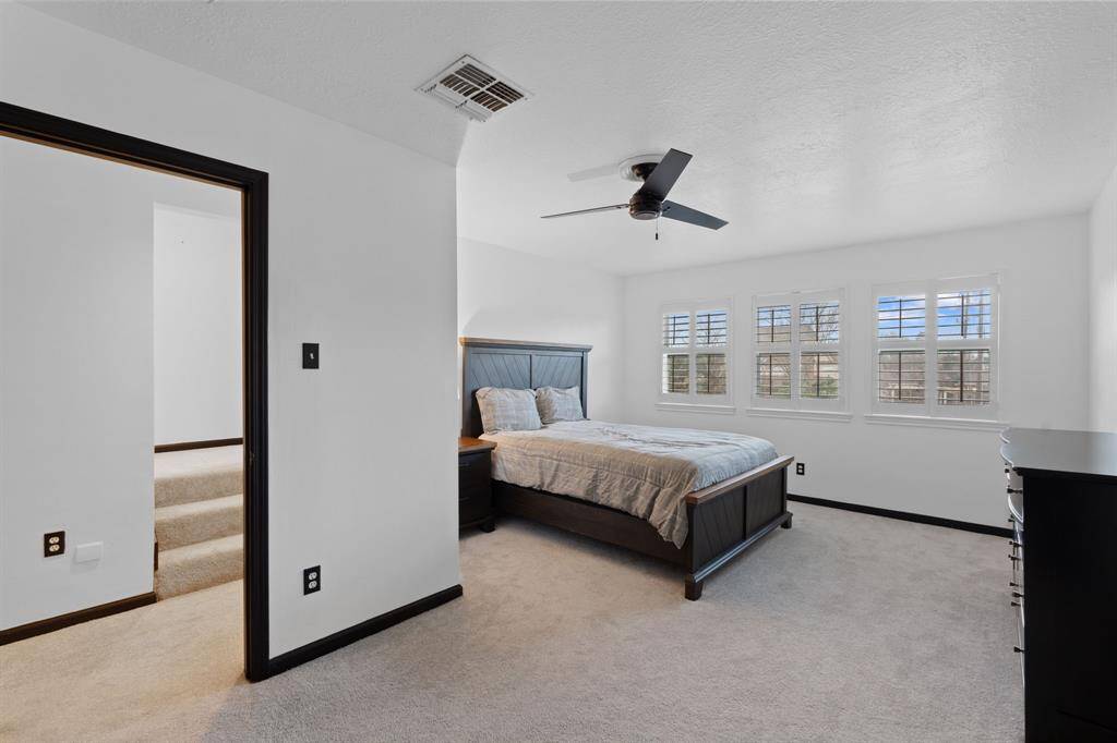 Guest room 2 is large with room for a couch or additional furniture and also has built-in dresser in the closet.  It overlooks the backyard.