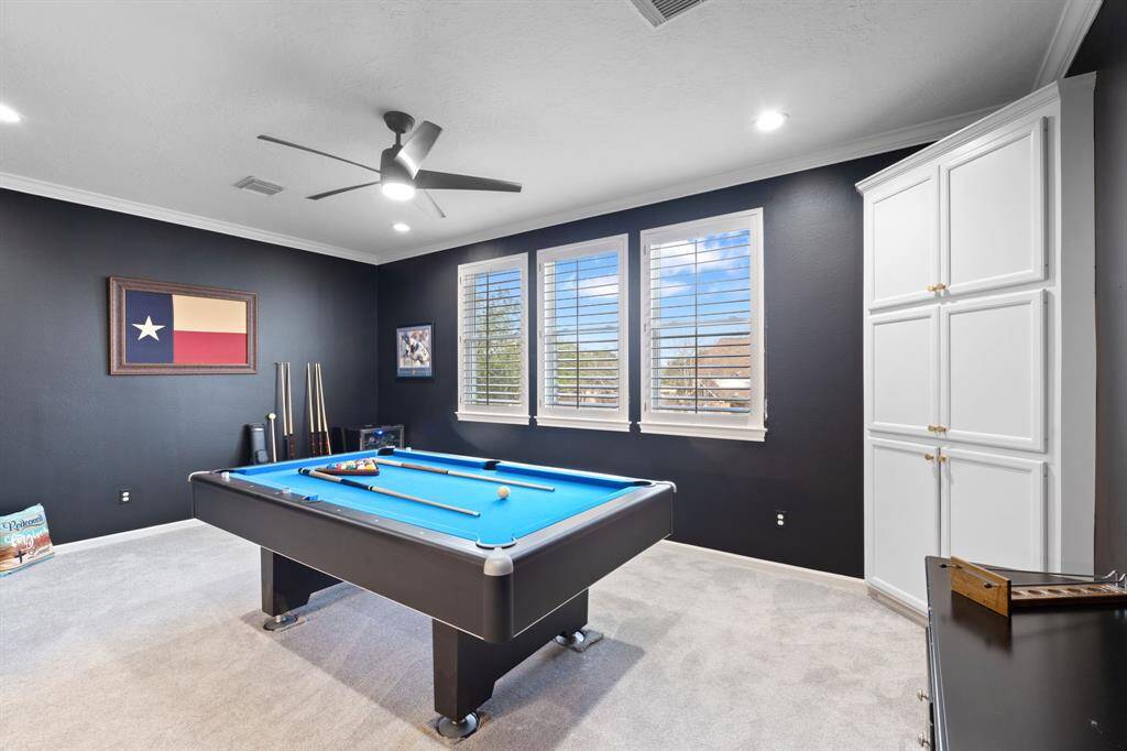 Guest room 3 is currently used as a game room, but does have a large walk-in closet so could easily be used as a 4th bedroom.  It also overlooks the backyard.