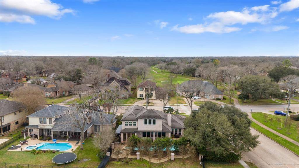 The back view shows that you'll have plenty of privacy with the trees and landscaping currently in place.