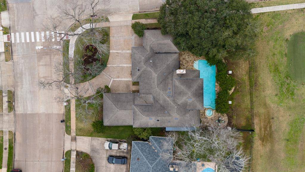 Bird's eye view of the 11,441 sq ft corner lot backing up to the #2 tee box on the golf course.