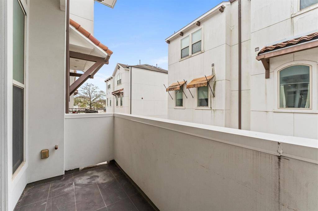 The balcony is a peaceful escape, where fresh air and open skies create the perfect backdrop for quiet moments.