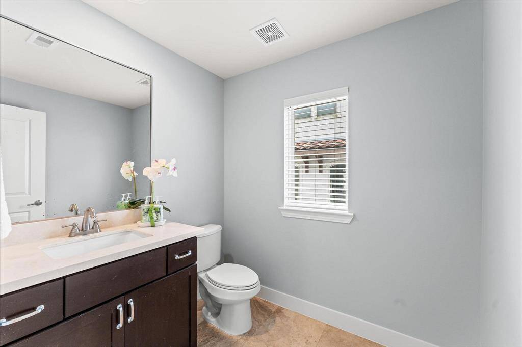 Thoughtfully placed for convenience, the second-floor half bath is both stylish and functional.