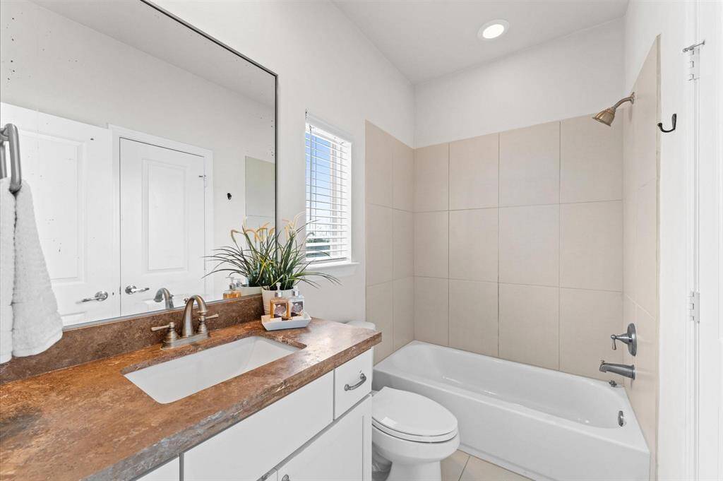 Sleek and functional, the first-floor en suite bathroom offers a private retreat with modern finishes.