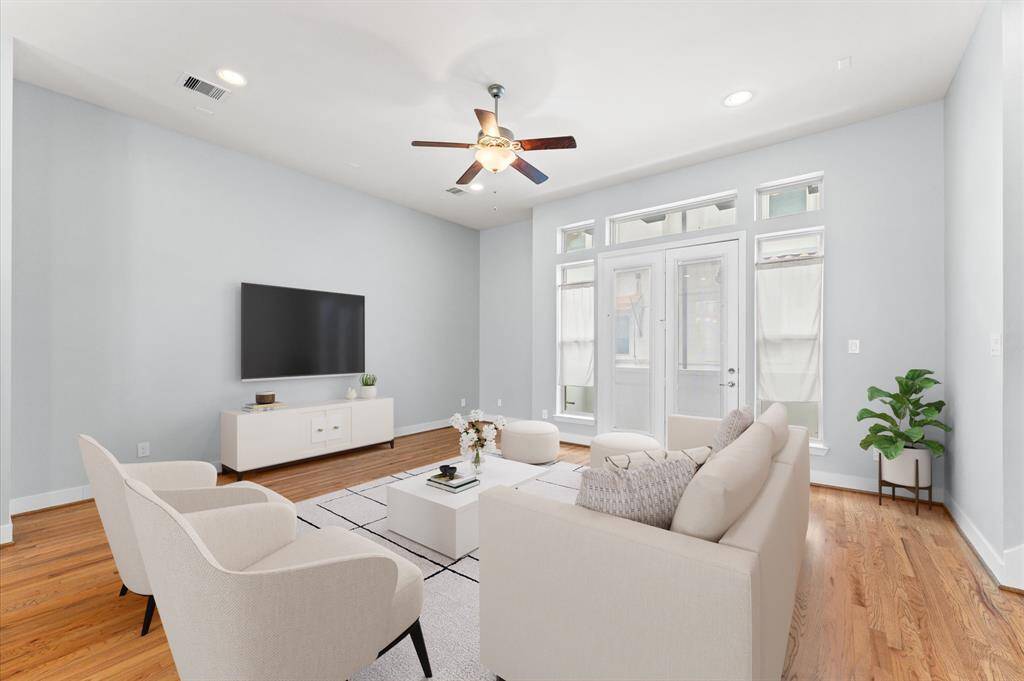 Wide windows bring in an abundance of natural light, while the living room extends to a lovely balcony—perfect for morning coffee or evening relaxation.