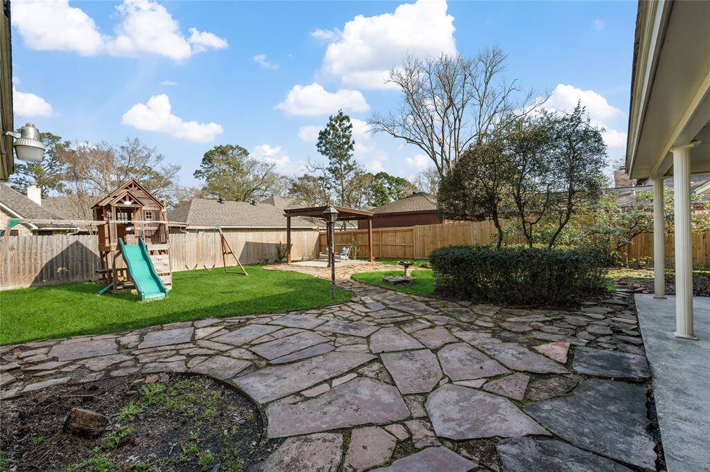 Covered patio & play equipment stays!