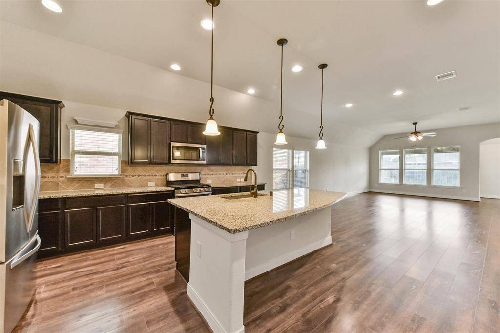 Breakfast bar island with sink.