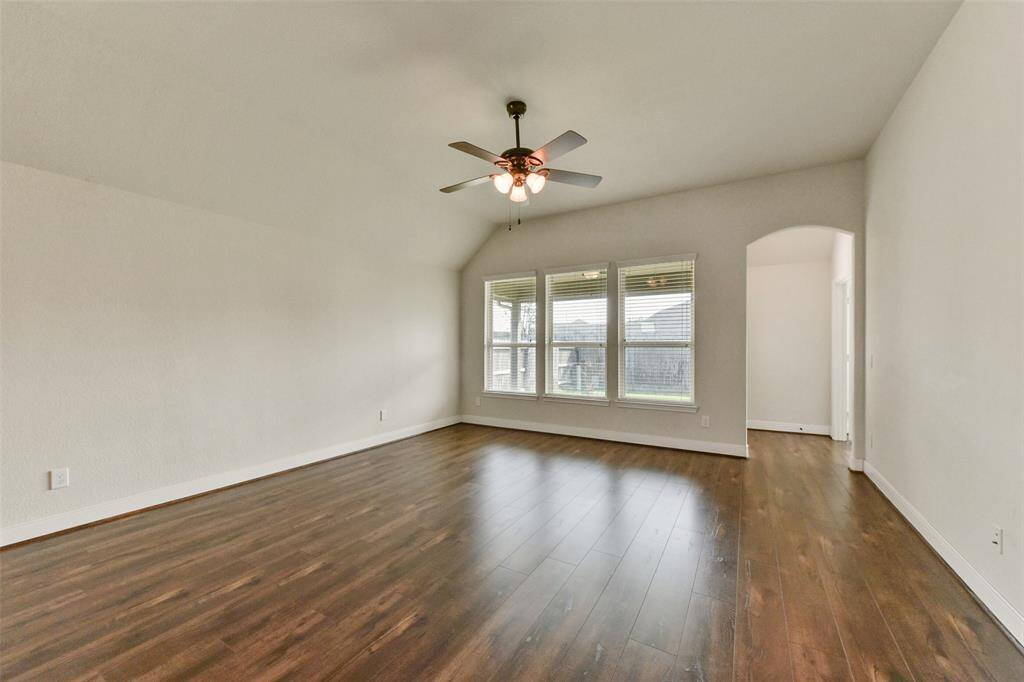 Family room windows look out over the covered back patio.